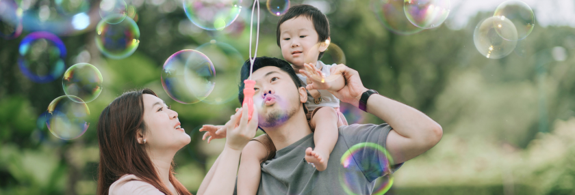 Family playing bubbles