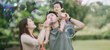 Family playing bubbles