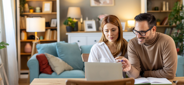 Couple looking at laptop