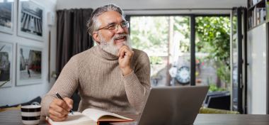 Man thinking and writing