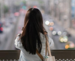 Girl looking at the city
