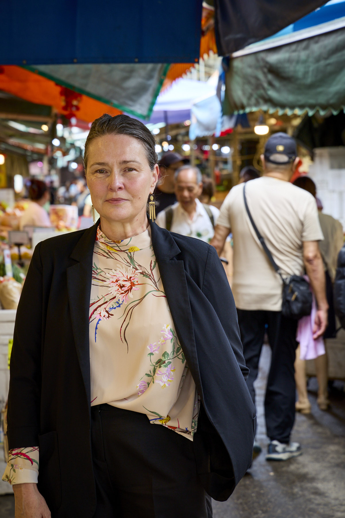 kay standing at a market