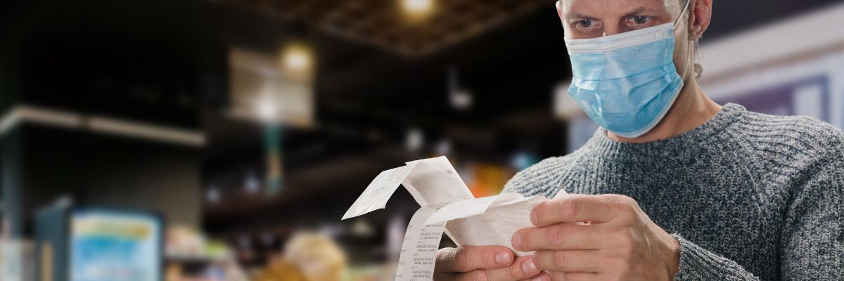 man holding receipt