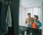 elderly couple mirror reflection in toilet