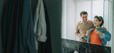 elderly couple mirror reflection in toilet