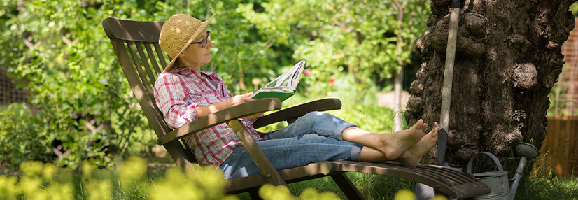 Middle aged woman resting on bench