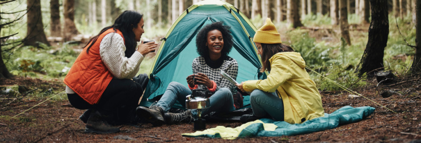 Three women camping together
