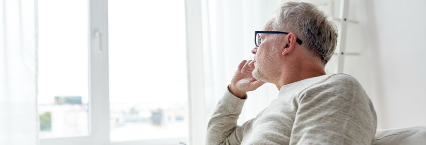 Man looking out of window
