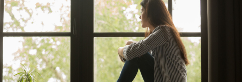 Woman looking out the window